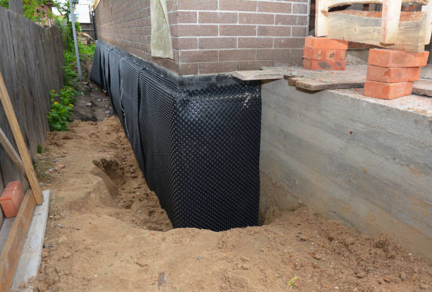 Happy homeowners after waterproofing job in Rubicon